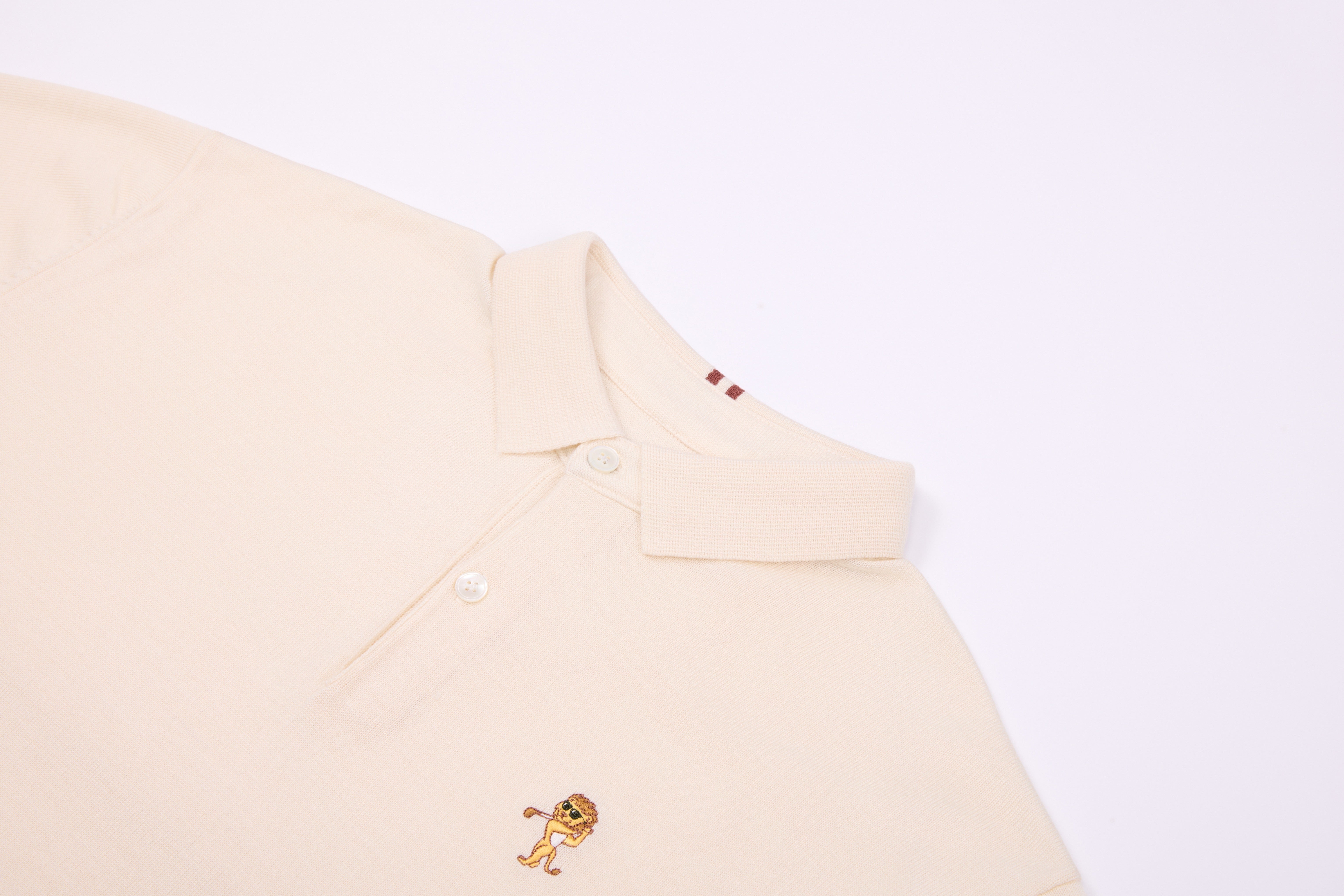 Performance Knit Polo – Ivory | Lion Collection | wehitfairways